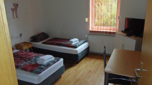 Ένα ή περισσότερα κρεβάτια σε δωμάτιο στο Hostel Schützenbrücke