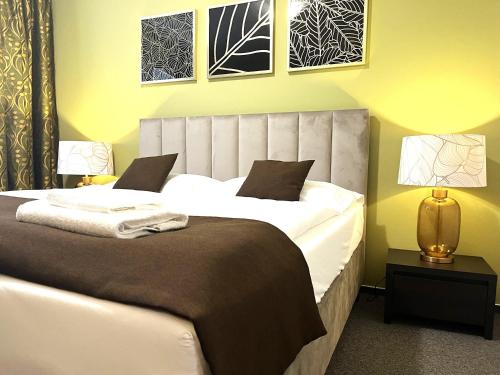 Posteľ alebo postele v izbe v ubytovaní Hotel Zlatý Býk