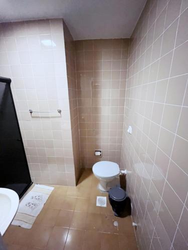 a bathroom with a toilet and a sink at Solar Hostel Centro in Rio de Janeiro