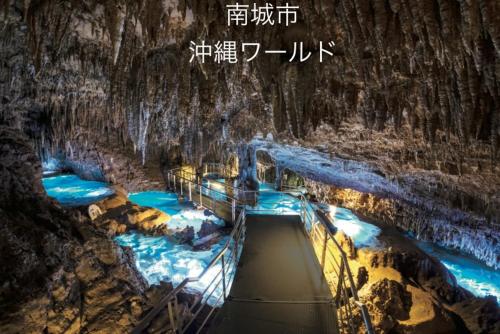 a painting of a cave with water in it at Yellow House Okinawa in Naha