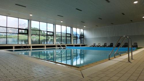 a large swimming pool in a large building at Parkhotel Olsberg in Olsberg