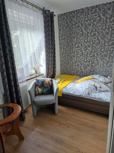 Postel nebo postele na pokoji v ubytování Bialy Dom