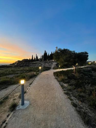 a dirt road with lights on it at sunset at Casa Alberto 2 izda in Tudela
