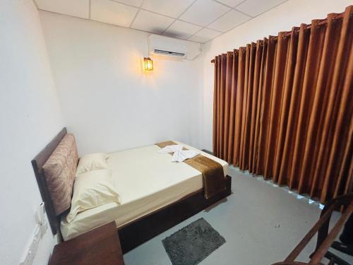 Postel nebo postele na pokoji v ubytování Bael House Ahangama
