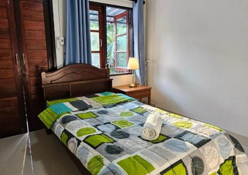 Ένα ή περισσότερα κρεβάτια σε δωμάτιο στο Stoner Guest House