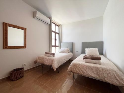 Una cama o camas en una habitación de Casa Alpine - 2 bedroom apartment with large terrace