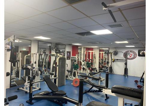 a gym with a lot of equipment in it at Navarria Blue Hotel in Limassol