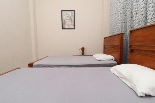 Katil atau katil-katil dalam bilik di Pawra wood inn