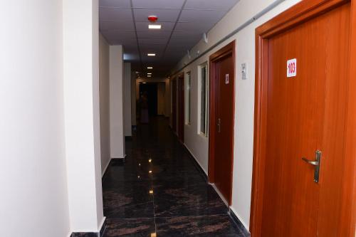 a hallway of an office building with a long corridor at Perfect Residency in Mayiladuthurai