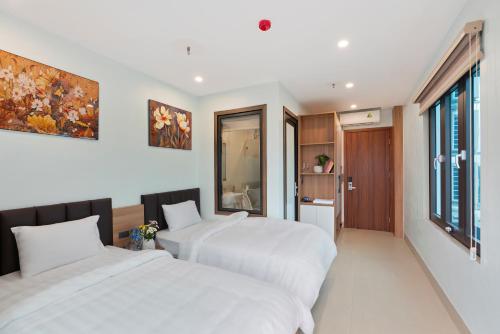 Ένα ή περισσότερα κρεβάτια σε δωμάτιο στο Tam Coc Guest House One & Hotel Ninh Binh