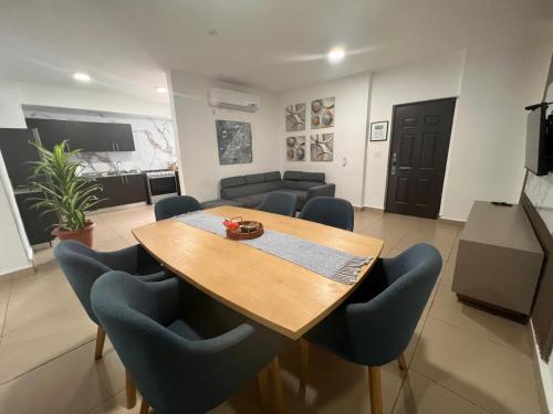 a conference room with a wooden table and chairs at Blue Dream in San Francisco in Panama City