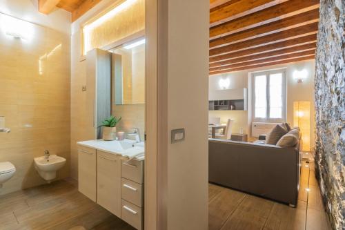 a bathroom with a sink and a toilet at Domus in Como by Rent All Como in Como
