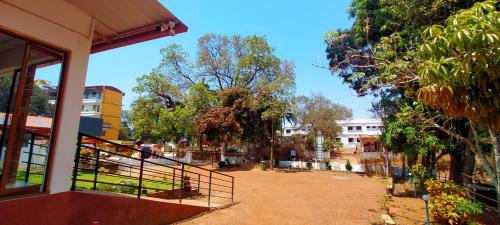 a view of a street with trees and buildings at West Coast Gokarna in Gokarna