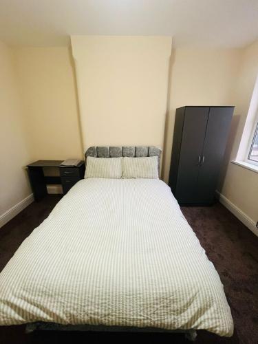 a bedroom with a large bed in a room at Double Room Near Railway station & Football Ground 88 in Nottingham