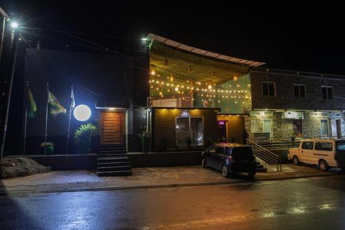 a car parked in front of a building at night at Aylane Hotel in Nampula