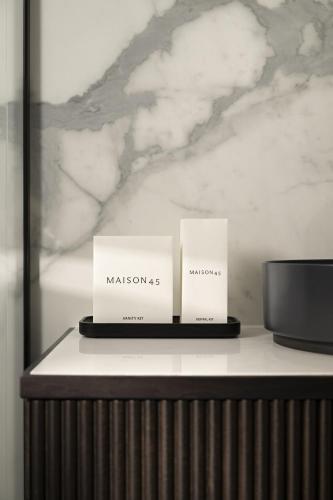 two boxes sitting on top of a table at Maison 45 - Luxury Boutique Hotel in Budapest