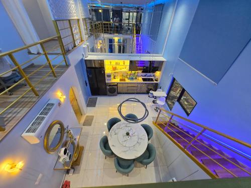 an overhead view of a room with a table and chairs at StarSuiteAC at Arte Cheras with Soundproof Karaoke, Billiard, Air-Hockey in Kuala Lumpur