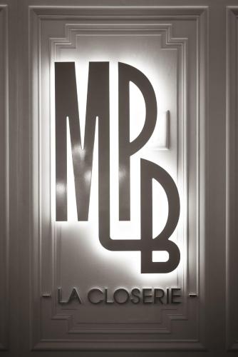 a metal door with the words mrldlele on it at Maison Philippe Le Bon Hôtel, Restaurant & Bar le 19 in Dijon