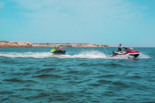 two people on a jet ski in the water at Bavaro Beach Dakhla in Dakhla