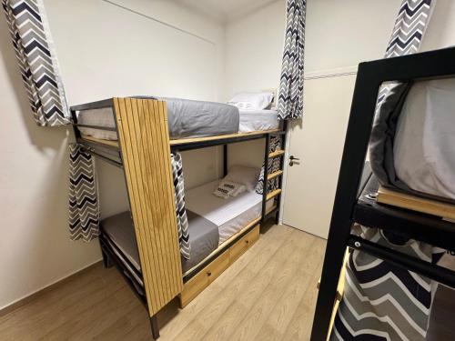 a room with two bunk beds in it at Nomads Hostel in Dahab