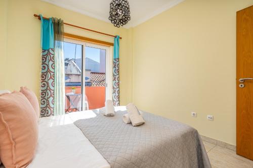 Postel nebo postele na pokoji v ubytování Casa Rosa Alvor