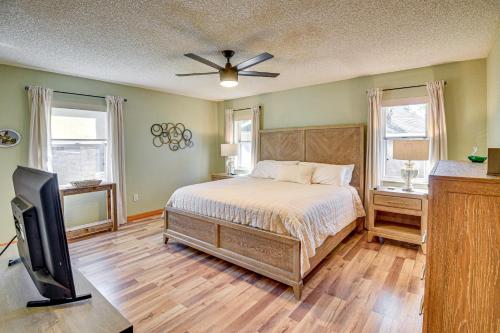 a bedroom with a bed and a flat screen tv at Private Outdoor Oasis Luxe Palm Coast Retreat in Palm Coast