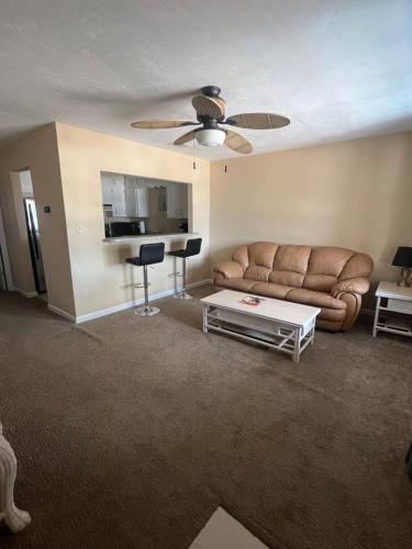 a living room with a couch and a table at The Moorings Hotel and Marina of Carrabelle in Davis Island