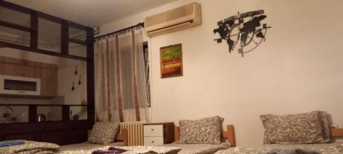 a living room with a couch and a chair at rm castell apartments in Novi Sad