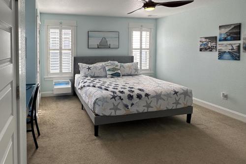 a bedroom with a bed and a ceiling fan at Days to Remember in Avon