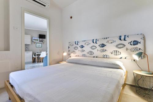A bed or beds in a room at Villa Fantagali apt 502