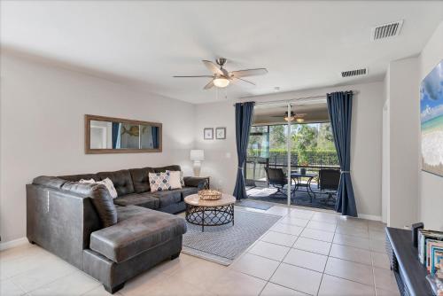 a living room with a couch and a ceiling fan at 25128 East Lenox in Punta Gorda
