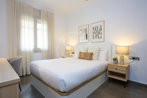 En eller flere senge i et værelse på Céntrico apartamento