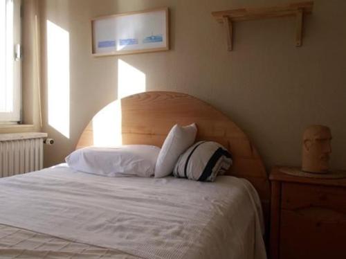 Postel nebo postele na pokoji v ubytování Ferienhaus In Norden Mit Großem Garten