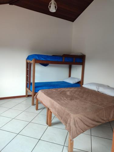 Postel nebo postele na pokoji v ubytování Pousada Encanto Torrely Búzios