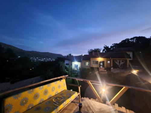 a view from the balcony of a house at night at EMMY'S HIDE AWAY in Iringa