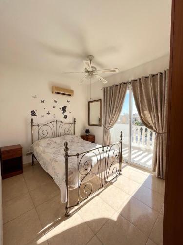 Ένα ή περισσότερα κρεβάτια σε δωμάτιο στο Diana Townhouse 2