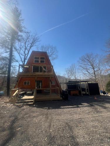 a house is sitting on top of a trailer at Cabin in the treetops! in Lancaster