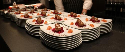 a row of plates of food on a table at Wellings Parkhotel in Kamp-Lintfort