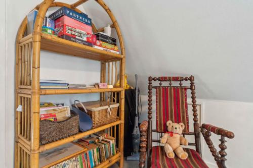 a teddy bear sitting on a chair in a room at Lovely Holiday Home Near Gudhjem in Gudhjem