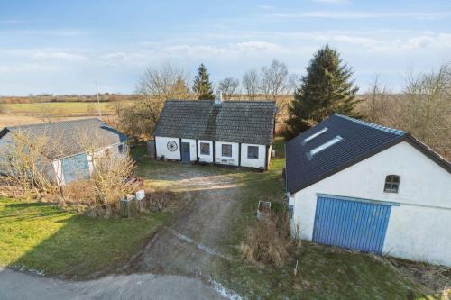 an aerial view of a white house with a garage at Lovely Holiday Home Near Gudhjem in Gudhjem