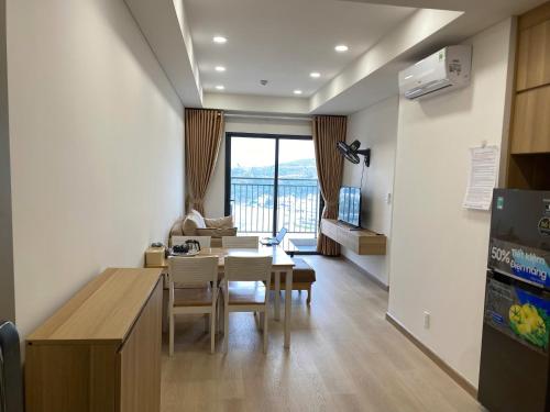 a kitchen and dining room with a table and chairs at Homestay Dragon Castle Bãi Cháy Hạ Long Quảng Ninh in Ha Long
