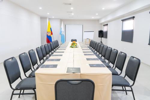 a long conference room with a long table and chairs at Ribai Hotels Santa Marta in Santa Marta
