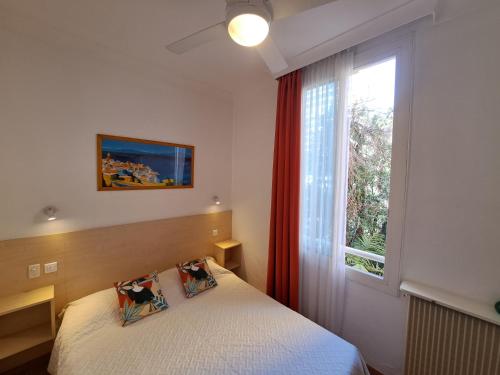 Ένα ή περισσότερα κρεβάτια σε δωμάτιο στο Residence Veles Plage