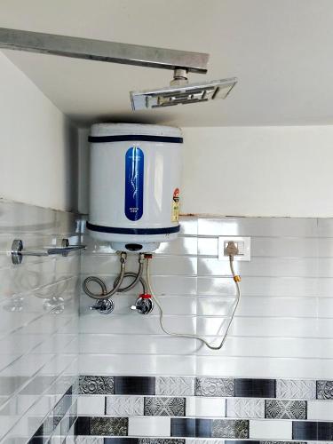 a pepsi machine on the wall of a bathroom at Solitude in the Himalayas in Darjeeling