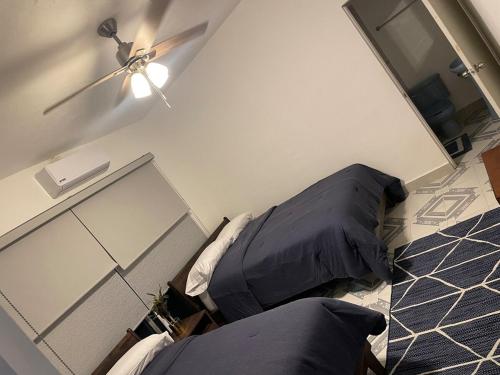 Ein Bett oder Betten in einem Zimmer der Unterkunft Quinta ColMex