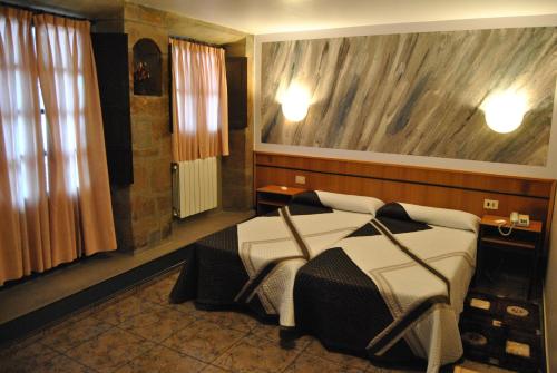 Giường trong phòng chung tại Hotel Palacio de los Vallados