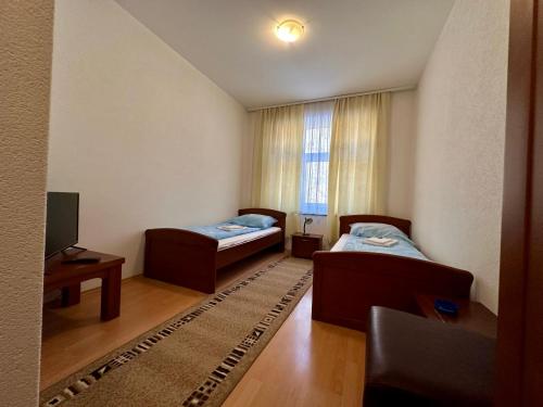 Postel nebo postele na pokoji v ubytování Wellness & Spa - Hotel Oaza