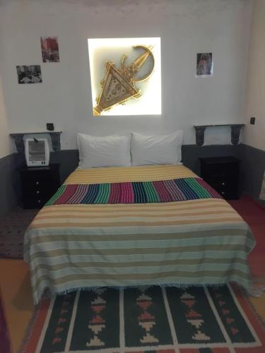 Postel nebo postele na pokoji v ubytování Riad Tigmi du Soleil