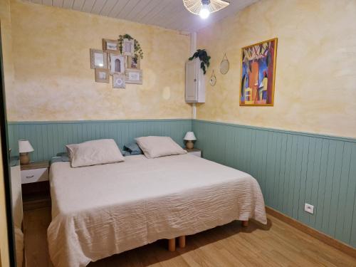 a bedroom with a large bed in a room at Le Devant de la Chaux in Pontaix