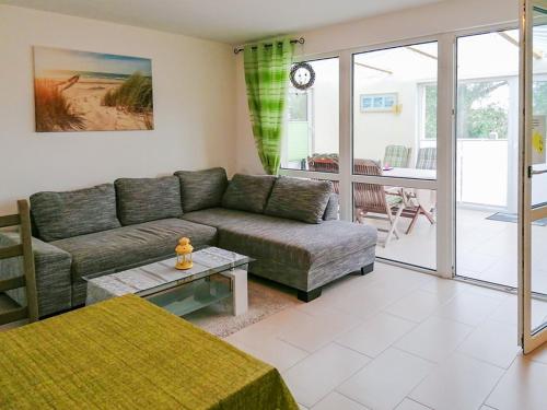 a living room with a couch and a table at Ferienhaus "Steffi" in Rerik